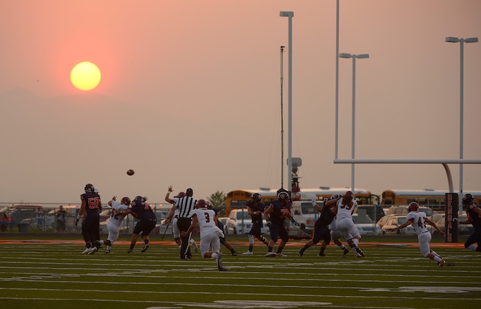 (Leah Hogsten  |  The Salt Lake Tribune)  Brighton High School leads Herriman High School 9-7 at the half during the 2015 season opener at Brighton High School, Friday, August 21, 2015. 