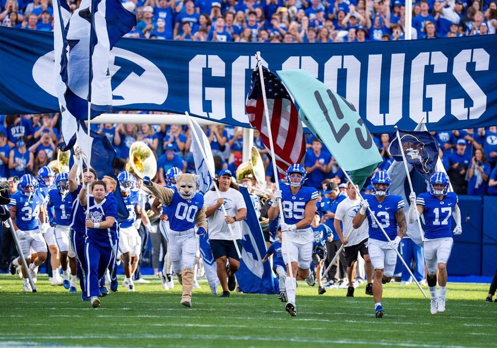 (Rick Egan | The Salt Lake Tribune) The Brigham Young Cougars take the field for football action between the Brigham Young Cougars and the Utah State Aggies, at LaVell Edwards Stadium in Provo, on Thursday, Sept. 29, 2022.