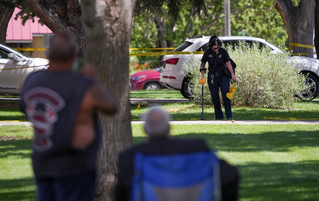 (Chris Samuels | The Salt Lake Tribune) Onlookers watch as police investigate a shooting that occurred outside a meetinghouse of The Church of Jesus Christ of Latter-day Saints in Kearns, Monday, Aug. 17, 2026.