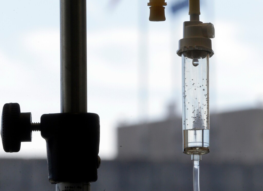 (Gerry Broome | The Associated Press) In this Sept. 5, 2013 file photo, chemotherapy is administered to a patient via intravenous drip.