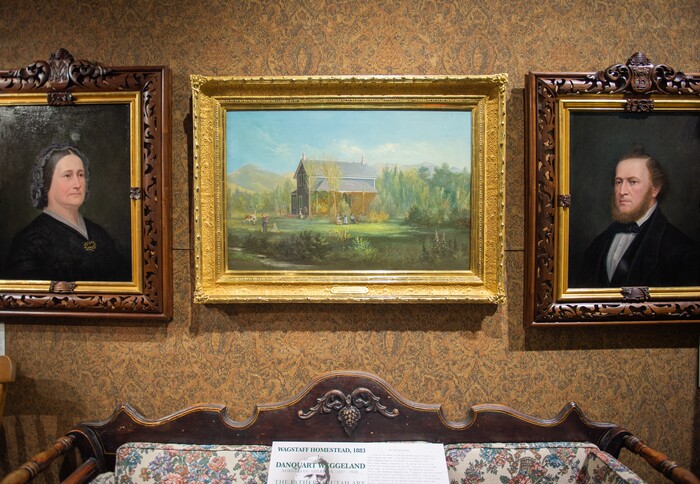 (Rachel Molenda  |  The Salt Lake Tribune)  Paintings by artists Danquart Anthon Weggeland, center,  and Enoch Wood Perry Jr., left and right, sit above a pioneer era bishop's sofa at Anthony's Fine Art in Salt Lake City, on Thursday, July 19, 2018. The shop has a collection of early pioneer art and furniture on display.