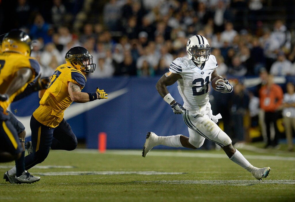 Scott Sommerdorf   |  The Salt Lake Tribune  BYU RB Jamaal Williams (21) runs for some of his 286 yards rushing as BYU defeated Toledo 55-53, Friday, September 30, 2016. Williams also scored 5 TDs.
