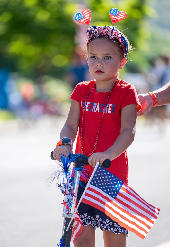 (Rick Egan | The Salt Lake Tribune)  Amanda Casey, 6, rides in the Kids bike parade, during the Cherry Days Fourth of July celebration, in North Ogden, on Monday, July 4, 2022.