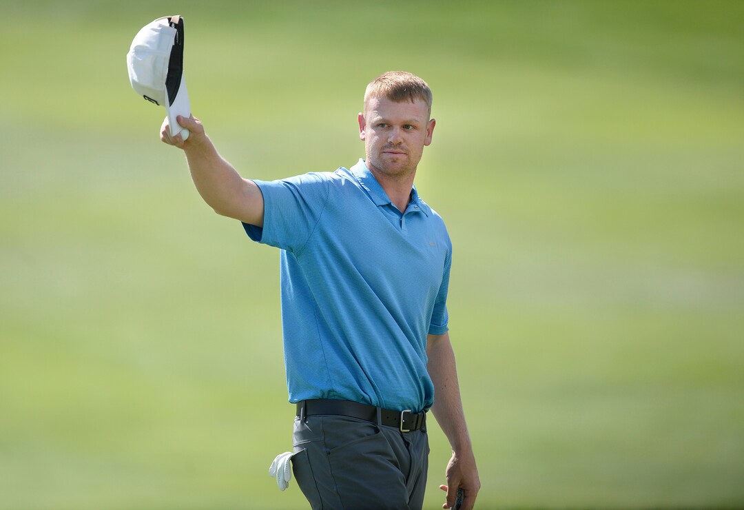 (Scott Sommerdorf   |  The Salt Lake Tribune)   Patrick Fishburn doffs his cap to the crowd after finishing his putt on the 18th green, to win the Utah Open golf tournament played at the Riverside Country Club, Sunday, August 27, 2017. Fishburn won by nine strokes over last year's winner, Zahkai Brown.