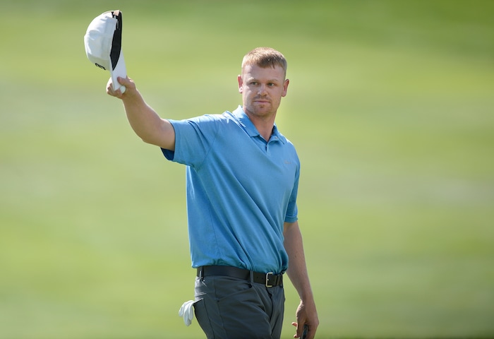 (Scott Sommerdorf | The Salt Lake Tribune)
Patrick Fishburn doffs his cap to the crowd after finishing his putt on the 18th green, to win the Utah Open golf tournament played at the Riverside Country Club, Sunday, August 27, 2017. Fishburn won by nine strokes over last year's winner, Zahkai Brown.