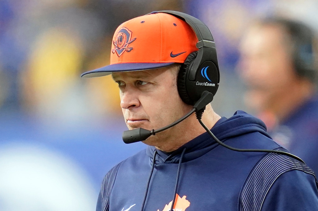 FILE - Virginia head coach Bronco Mendenhall watches from the sideline during an NCAA college football game against Pittsburgh, Saturday, Nov. 20, 2021, in Pittsburgh. Utah State is expected to hire Mendenhall, the former BYU coach who spent this past season at New Mexico, as its new head coach, multiple people briefed on the situation told The Athletic. A Utah native, Mendenhall went 99-43 in 11 seasons as BYU’s head coach from 2005 to ’15. (AP Photo/Keith Srakocic, File)