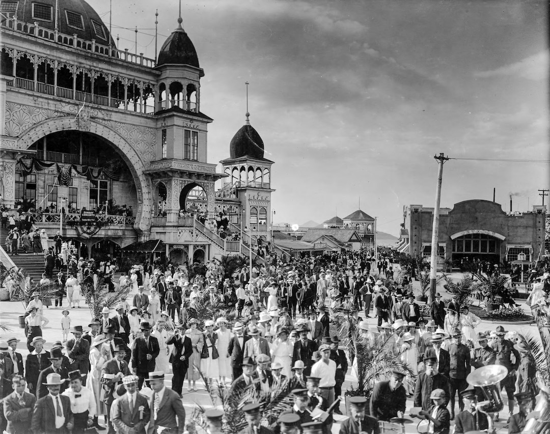 (Utah State Historical Society) Visitors to Saltair linger around the resort's entrance to hear a band play. Around the 1920s, the Saltair Resort began to be coined as the “Coney Island of the West,” hosting crowds in excess of 10,000 on holidays in the 1920s. 