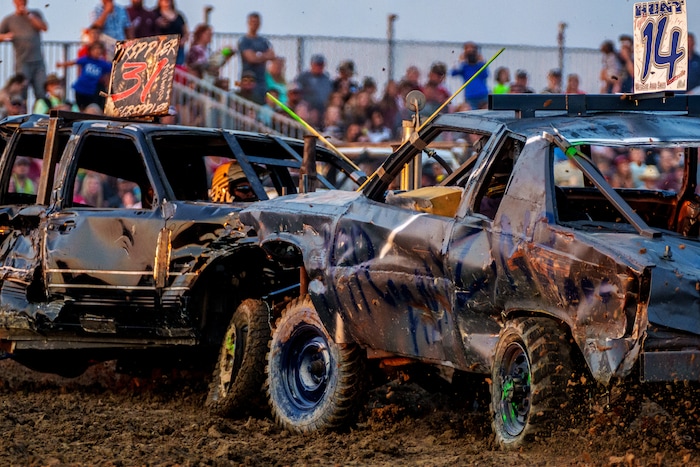 (Trent Nelson  |  The Salt Lake Tribune) Anthony Trippler and Taylor Hunt collide during Punishment at the Peak, a demolition derby in Grantsville on Saturday, Aug. 7, 2021.