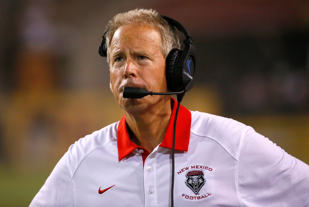 FILE - In this Septl. 18, 2015, file photo, New Mexico head coach Bob Davie walks the sidelines during the second half of an NCAA college football game against Arizona State, in Tempe, Ariz. Arizona State won 34-10. Four years after taking over the embattled football program at New Mexico, and 14 years since getting ousted as Notre Dame's head coach, Bob Davie has the Lobos playing in its first bowl game in nearly a decade.  (AP Photo/Matt Yor, File)