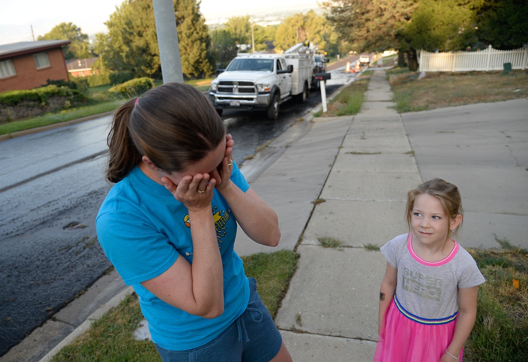 (Francisco Kjolseth  |  The Salt Lake Tribune)  Alysa Albertine is joined by her daughter Emery, 6, as she recalls the harrowing experience of having to flee her home in East Bountiful when a wildfire ignited in the early hours on Friday morning, Aug. 30, 2019. The fire was so close her shed was destroyed and three of her neighbors experienced a total loss of their homes. On Sept. 2, officials said the fire was 100% contained.