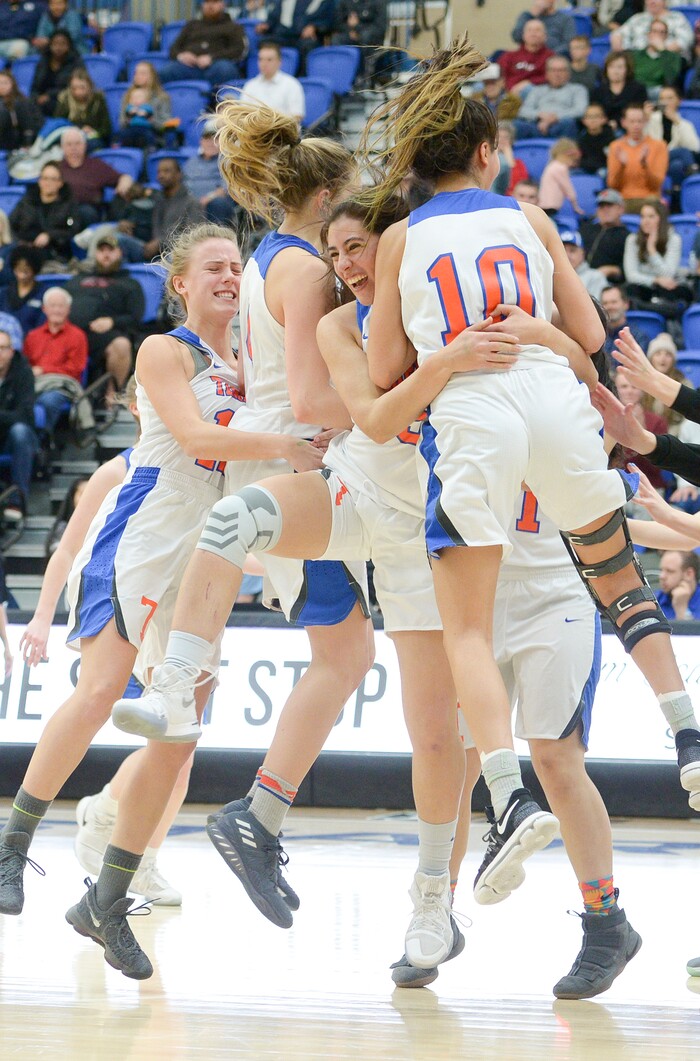 (Leah Hogsten  |  The Salt Lake Tribune) Timpview celebrates the win.  Timpview defeated Skyline 56-49 in their semifinal game of the 5A High School Girls' Basketball Tournament at SLCC in Taylorsville, Friday, Feb. 23, 2018. 