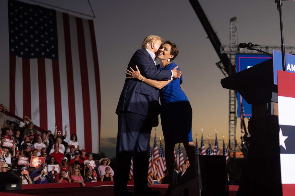 (Rebecca Noble | The New York Times) 

Kari Lake, Arizona's Republican gubernatorial candidate, embraces Donald Trump at his rally in Mesa, Ariz., on Oct 9, 2022.