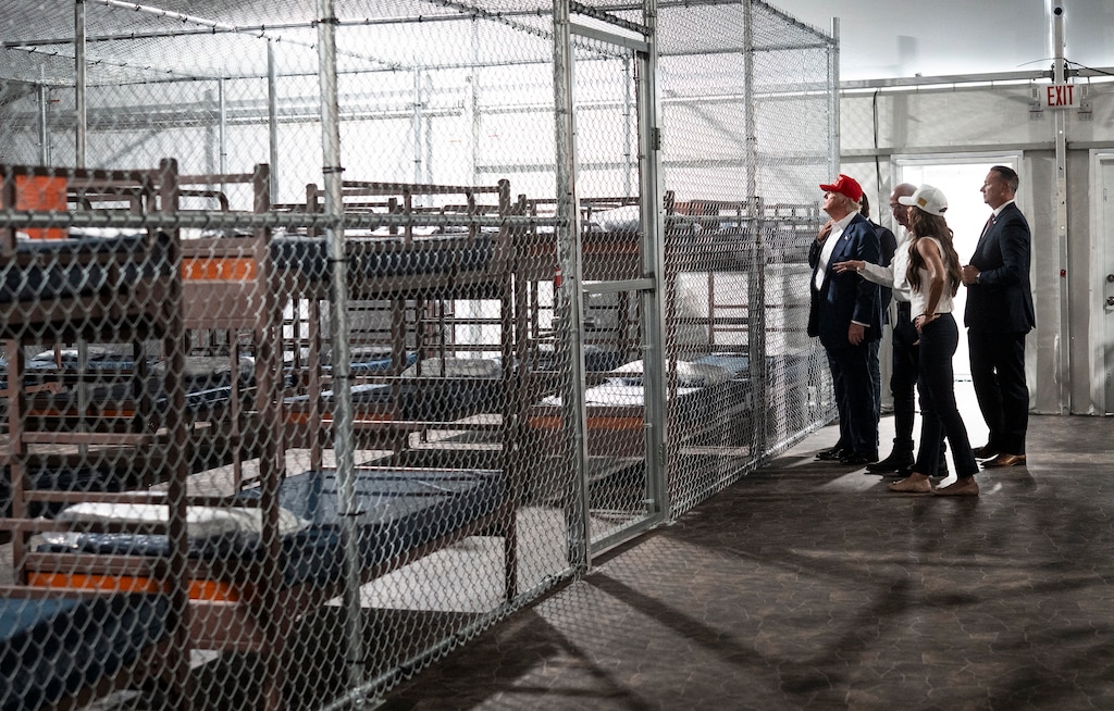 (Doug Mills | The New York Times) President Donald Trump tours a newly constructed area for a detention camp with Homeland Security Secretary Kristi Noem, foreground, in Ochopee, Florida, in July. Utah is reportedly in line to get a 10,000-bed detention center.