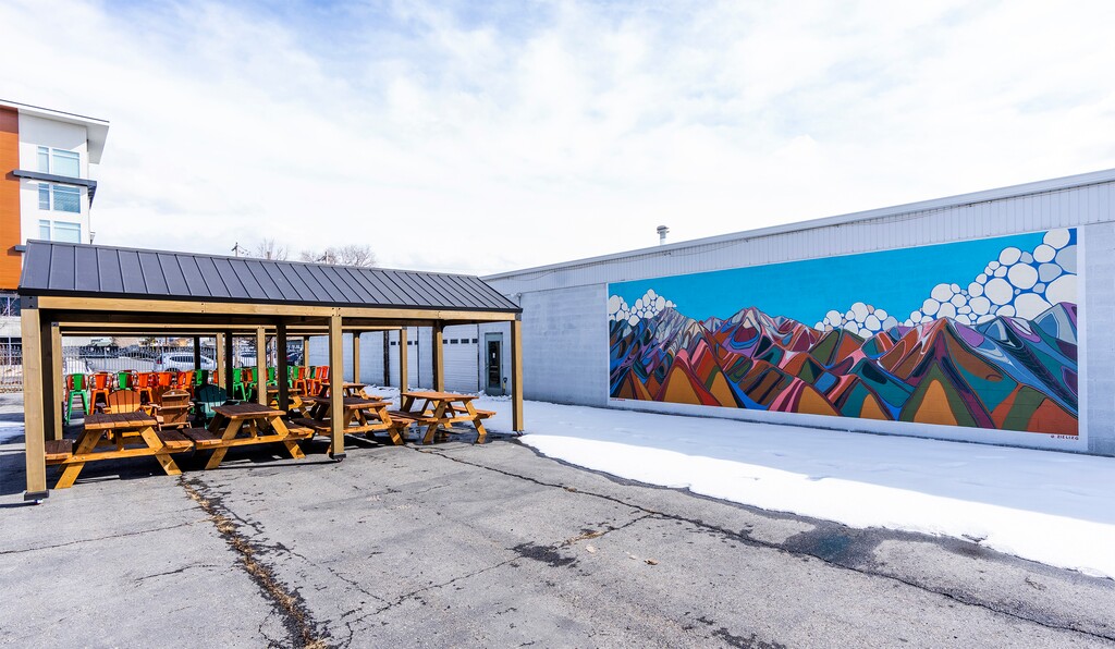 (Rick Egan | The Salt Lake Tribune) A mural by local artist Lizzie Wenger is shown at Second Summit Hard Cider in Millcreek along with tables and chairs on Thursday, March 2, 2023.