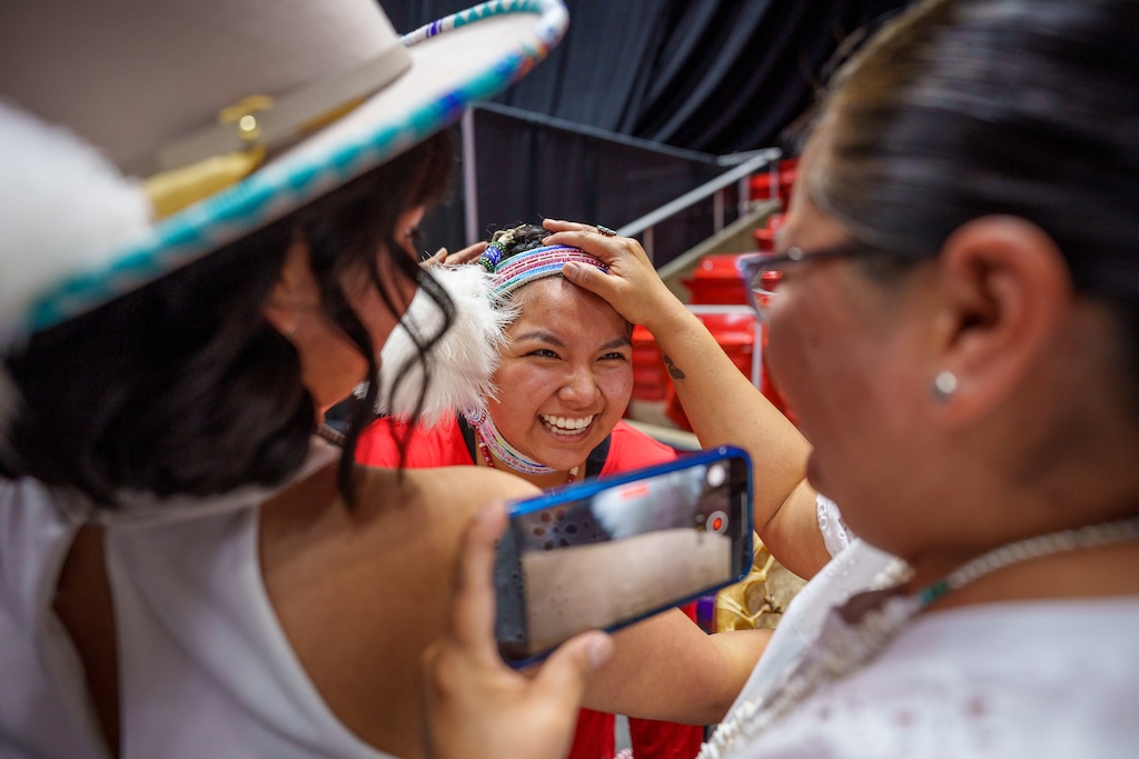 (Trent Nelson  |  The Salt Lake Tribune) Kayden Denny with her sister Jace and mother Tanya after performing a Native American hoop dance at Highland High School's graduation in Salt Lake City on Friday, June 9, 2023.