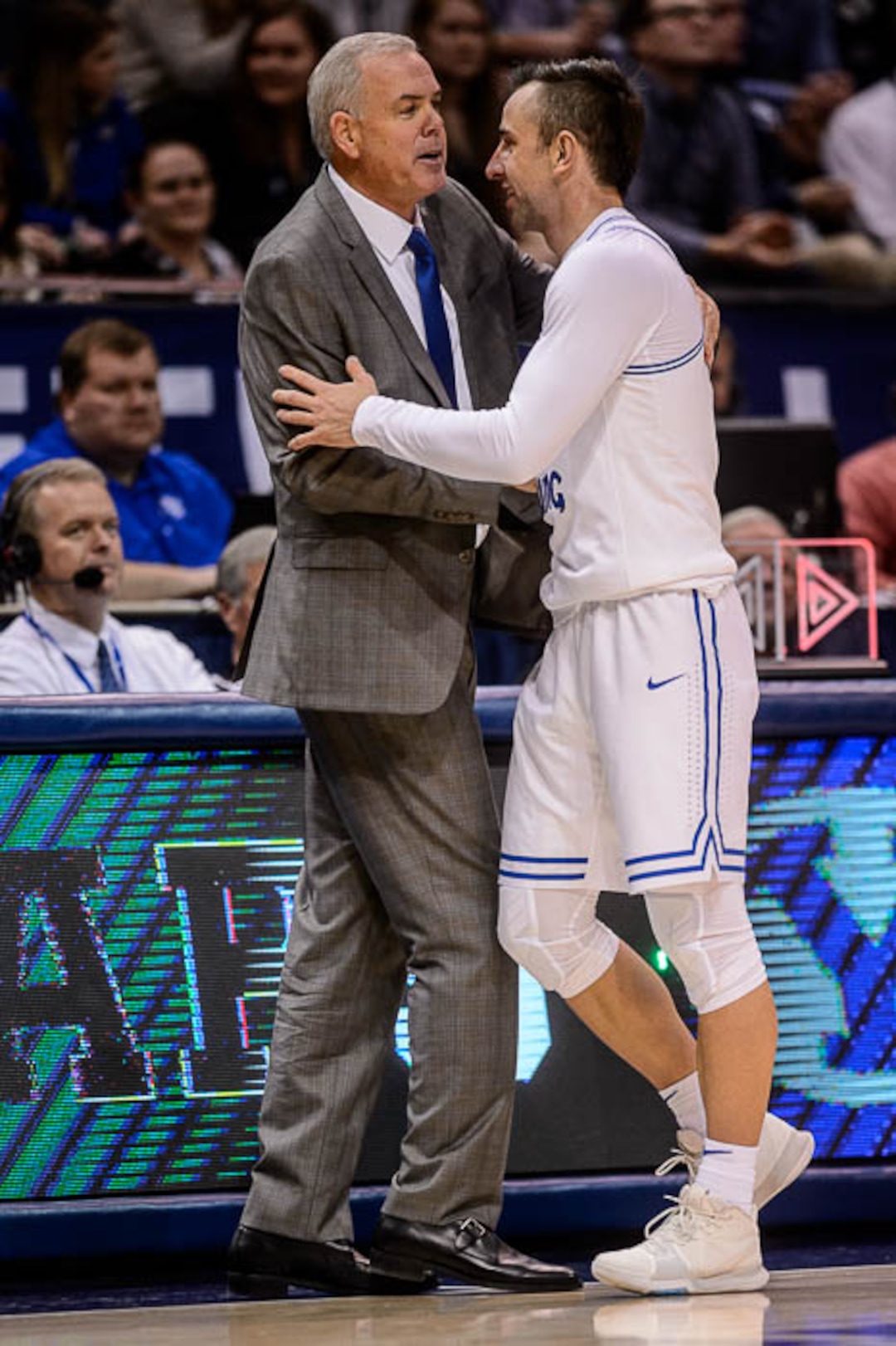 (Trent Nelson | The Salt Lake Tribune)  BYU coach embraces Brigham Young Cougars guard Nick Emery (4) as he comes off the court as BYU hosts Utah State, NCAA basketball in Provo on Wednesday Dec. 5, 2018.