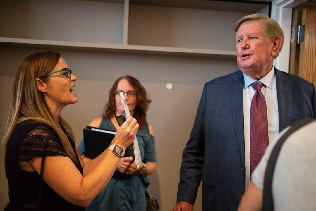 (Trent Nelson | The Salt Lake Tribune)  Candi Huff confronts Kem Gardner after a news conference where a coalition including the LDS Church came out against Utah's medical marijuana initiative, in Salt Lake City on Thursday Aug. 23, 2018.