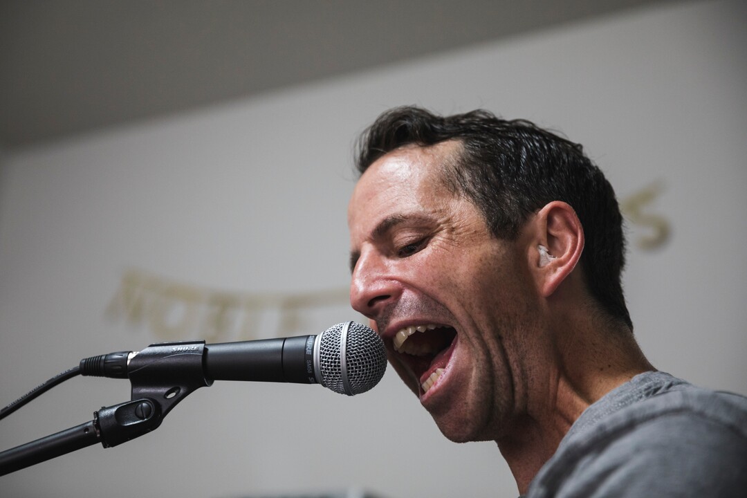 (Clark Clifford  |  For The Salt Lake Tribune) Bryce Taylor sings and plays guitar during a practice for an upcoming show in the band's rehearsal space in Orem on Saturday, Aug. 3, 2019.