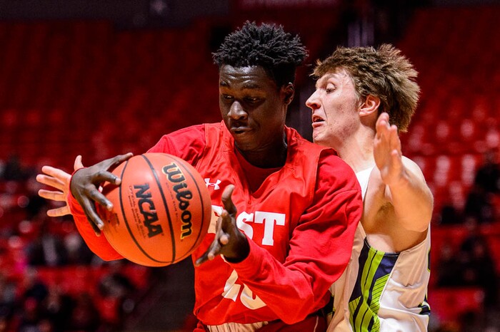 (Trent Nelson | The Salt Lake Tribune)  East vs. Timpanogos, 5A State high school basketball tournament at the Huntsman Center in Salt Lake City, Wednesday Feb. 28, 2018. East's Jeremy Jiba (20) and Timpanogos's Derik Eaquinto (34).
