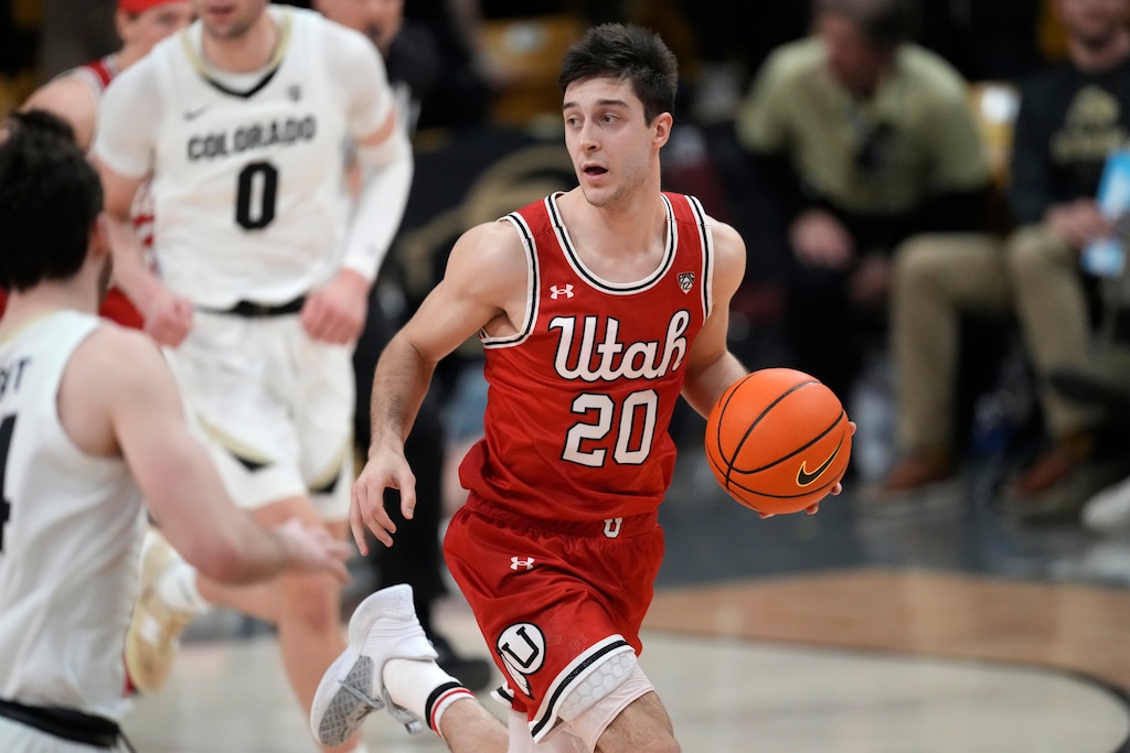 Utah guard Lazar Stefanovic pulls in the ball in the first half of an NCAA college basketball game against Colorado, Saturday, March 4, 2023, in Boulder, Colo. (AP Photo/David Zalubowski)