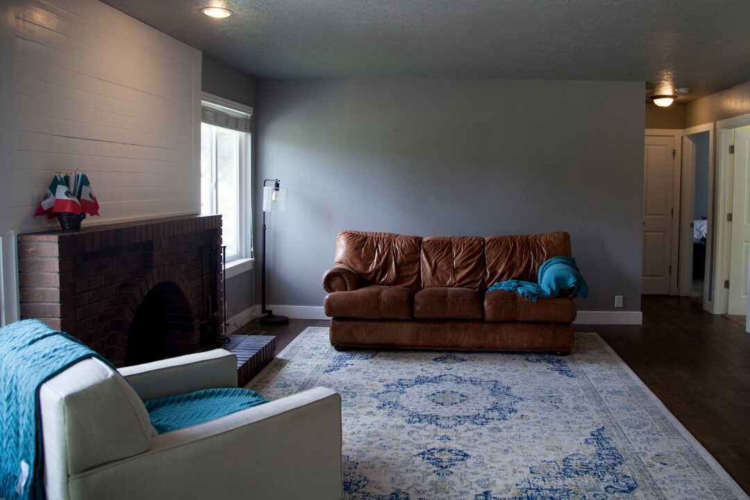 (Stella Yu |  The Salt Lake Tribune) The 2,713-square-foot rambler home in South Jordan includes five bedrooms, three and a half baths, two family rooms, a fireplace, a kitchen, a bar and a semi-formal dining room. A two-car garage is attached to the house with outdoor RV parking space.