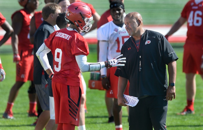 Scott Sommerdorf | The Salt Lake Tribune
Receivers coach Guy Holliday talks with WR Darren Carrington II during the first day of Utah fall football camp, Friday, July 28, 2017.