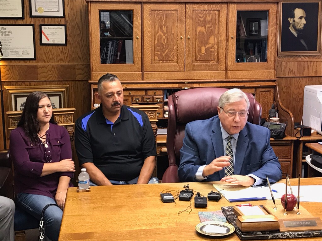 (Nate Carlisle | The Salt Lake Tribune) Rosa, left, and Juan Mercado sit beside Bob Sykes, one of their attorneys, during a news conference Sept. 16, 2019, at Sykes’ office in Salt Lake City. The family is asking Ogden to agree to a settlement over the Aug. 16, 2019, shooting death of their son Jovany Mercado.
