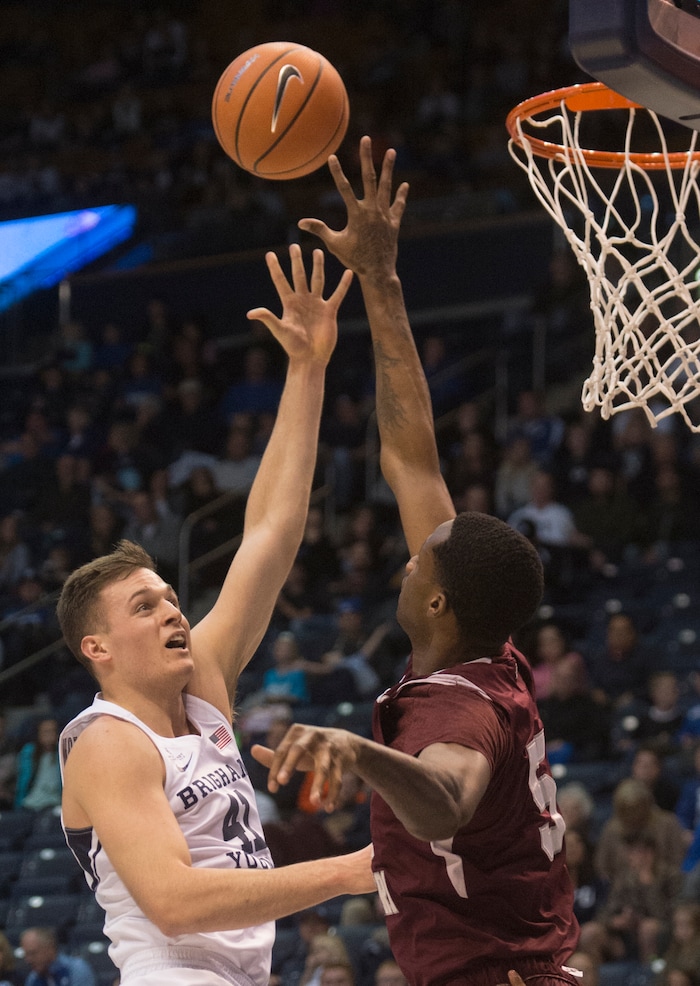 (Rick Egan  |  The Salt Lake Tribune)   Texas Southern Tigers center Trayvon Reed (5) blocks a shot by Brigham Young Cougars forward Luke Worthington (41), in basketball action, Brigham Young Cougars vs Texas Southern Tigers, at the Marriott Center in Provo, Saturday, December 23, 2017.