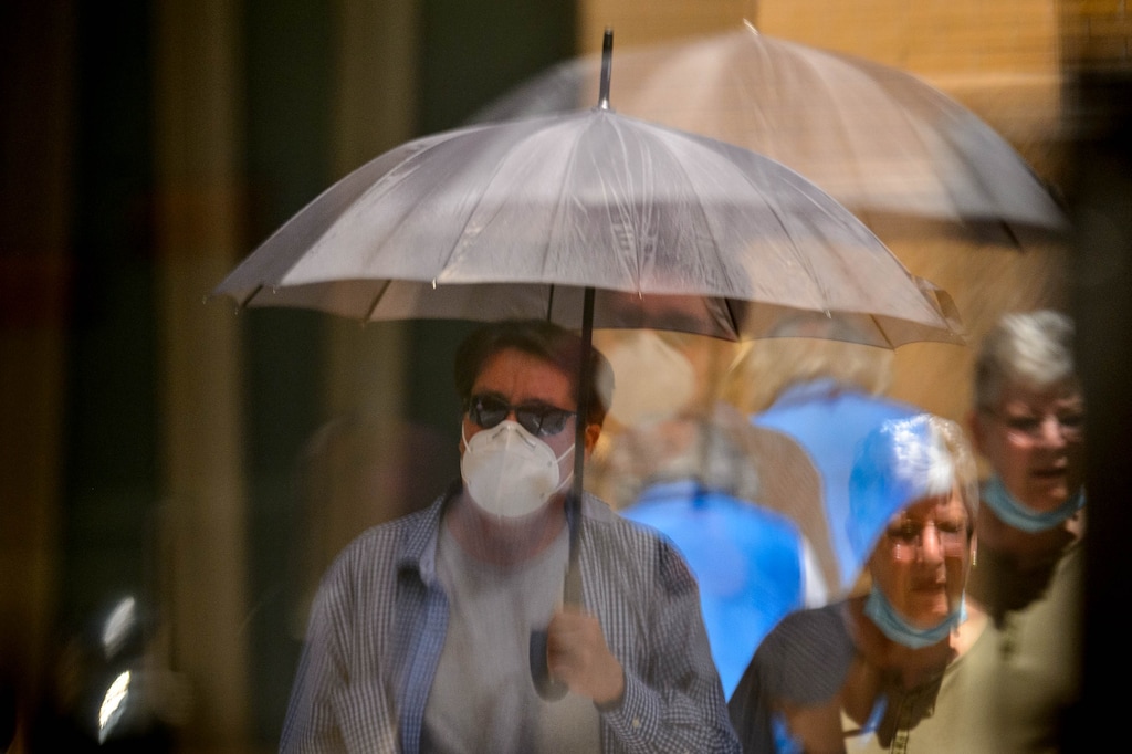 (Trent Nelson | Tribune file photo) People wearing masks are reflected in a window on Main Street in Salt Lake City on Tuesday, June 23, 2020. Mask wearing will be required in Salt Lake and Summit counties beginning Saturday.