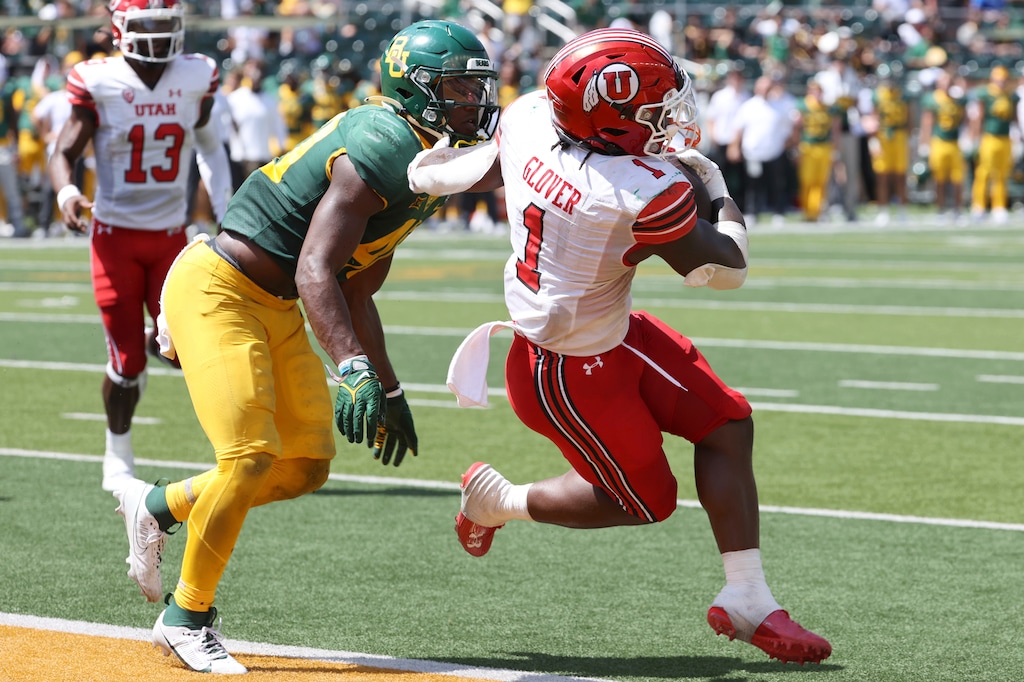 Utah running back Jaylon Glover scores a touchdown past Baylor linebacker Brooks Miller in the second half of an NCAA college football game, Saturday, Sept. 9, 2023, in Waco, Texas. (AP Photo/Jerry Larson)