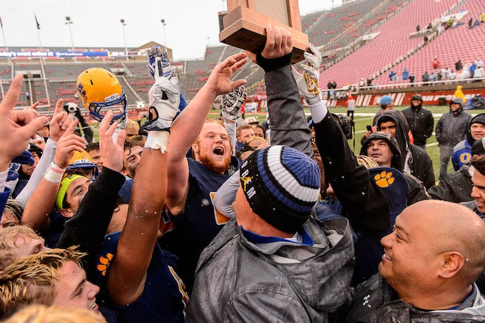 (Trent Nelson | The Salt Lake Tribune)  Orem players celebrate the win over Mountain Crest in the Class 4A High School State Football Championship game in Salt Lake City, Friday November 17, 2017.