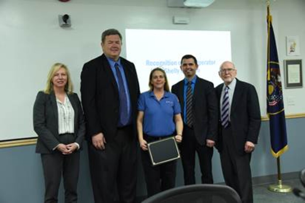 (Photo courtesy of Utah Transit Authority) Bus operator Shelly Monson receives citation for heroism on Wednesday, Feb. 13, from UTA Board members and UTA Chief Operations Officer Eddy Cummins (second from right).