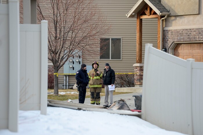 (Leah Hogsten | The Salt Lake Tribune) Weber County emergency personnel and firefighters work the scene of a small, private plane that crashed in a residential neighborhood in Roy, Jan. 15, 2020. A 64-year-old pilot was killed.