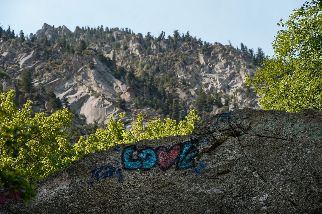 (Francisco Kjolseth  |  The Salt Lake Tribune)  Graffiti has proliferated in lower Little Cottonwood Canyon, where vandals, often wielding cans of fluorescent-colored spray paint, have covered granite faces, trees and structures. The vandalism is particularly apparent along the Temple Quarry Trail and the creek at the Moon Rock swimming hole and former pavilion site. Volunteers using donated equipment and solvents spend thousands of hours removing the paint from the rocks only to see graffiti return to the same faces or on rock nearby.