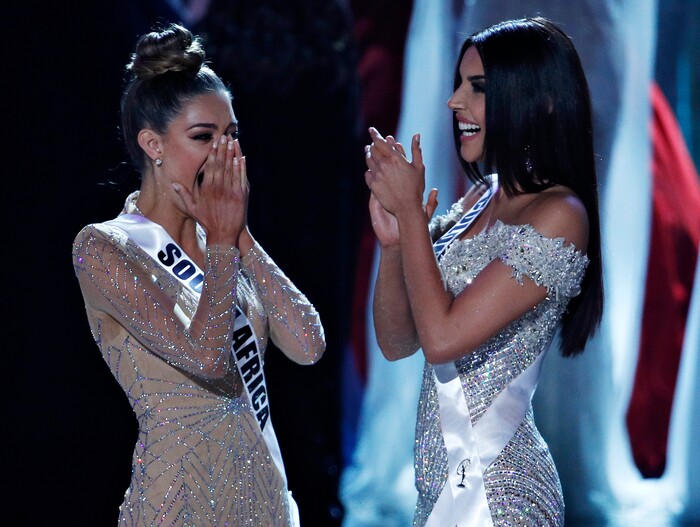 (John Locher | The Associated Press) Miss South Africa Demi-Leigh Nel-Peters, left, reacts as she was announced as the new Miss Universe at the Miss Universe pageant Sunday, Nov. 26, 2017, in Las Vegas. Miss Colombia Laura Gonzalez, right, is first runner up.