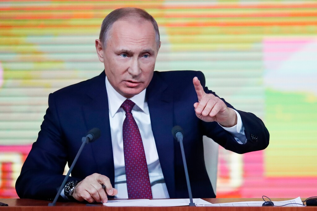 Russian President Vladimir Putin gestures during his annual news conference in Moscow, Russia, Thursday, Dec. 14, 2017. (AP Photo/Pavel Golovkin)