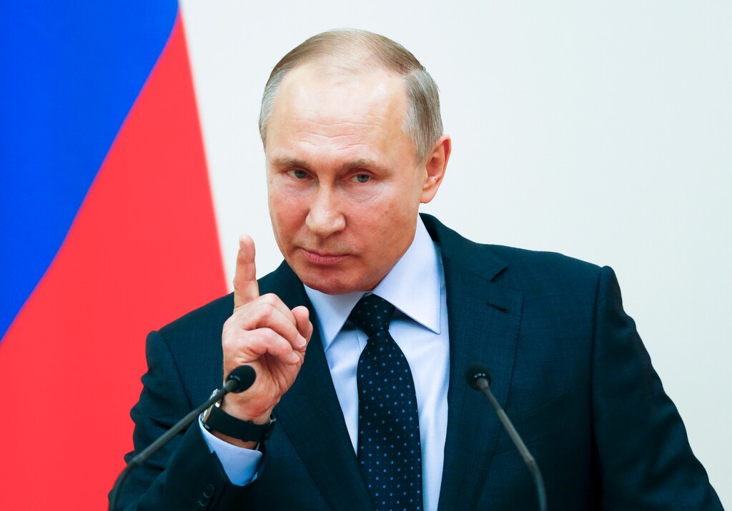 Russian President Vladimir Putin gestures while speaking during a meeting with the Russian athletes who will take part in the upcoming 2018 Pyeongchang Winter Olympic Games in South Korea, at the Novo-Ogaryovo residence outside in Moscow, Russia, Wednesday, Jan. 31, 2018. (Grigory Dukor/Pool Photo via AP)