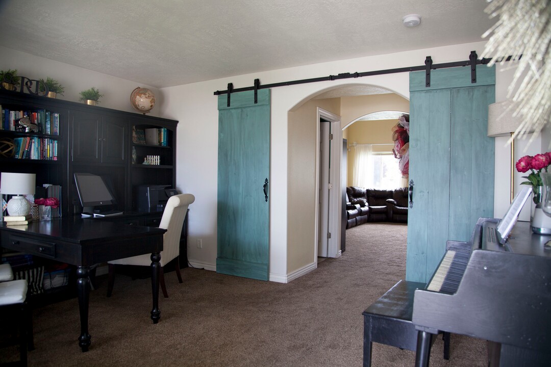 (Stella Yu |  The Salt Lake Tribune) Built in 2003, the 2,513-square-foot two-story home in Lehi comes with three upstairs bedrooms, two and a half baths, a kitchen, a family room and two dens with an open floor plan. The house also includes a two-car garage and space for RV parking.
