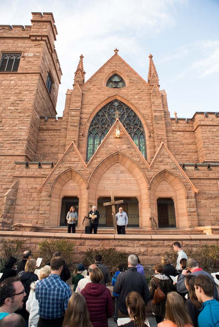 (Rick Egan  |  The Salt Lake Tribune)     Members of Christian denominations stop at the First Presbyterian Church, during the annual Good Friday procession through downtown Salt Lake City, Friday, March 30, 2018. The procession commemorating Christ's path to crucifixion has been a tradition of the Salt Lake Council of Churches since 1988. 


