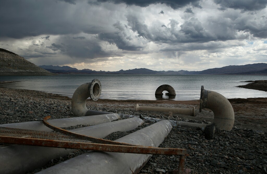 (John Locher | The Associated Press) In this May 18, 2015, file photo, water intake pipes that were once underwater sit above the water line along Lake Mead near Boulder City, Nev. U.S. government water managers said Wednesday, Aug. 15, 2018, that Lake Mead will be able to meet the demands of Mexico and Southwestern U.S. states for the next 13 months, but a looming shortage could trigger cutbacks in late 2019. Lake Mead is on the Colorado River, which serves 40 million people and 6,300 square miles of farmland in Arizona, California, Colorado, Nevada, New Mexico, Utah and Wyoming as well as Mexico.