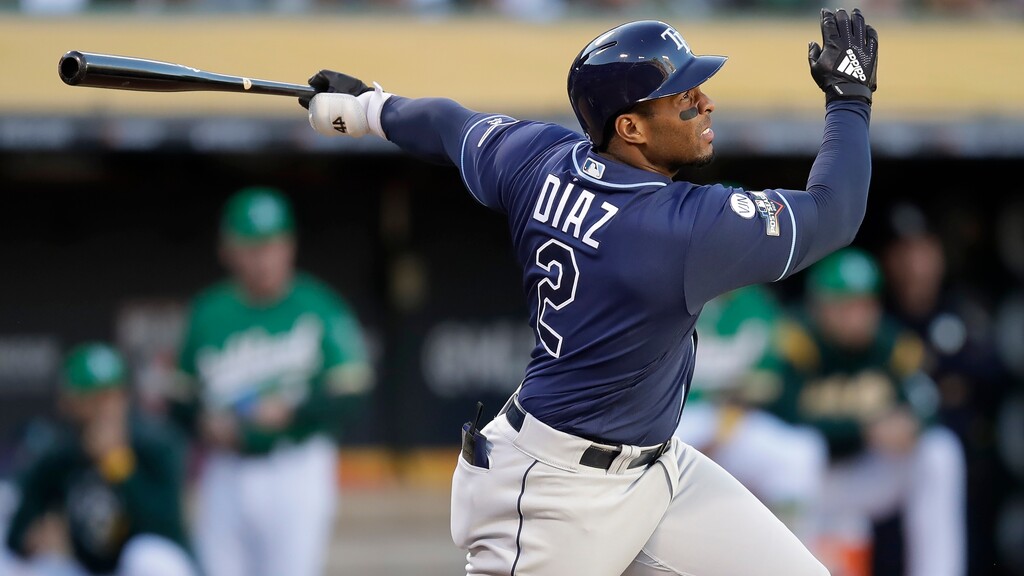 Tampa Bay Rays' Yandy Diaz watches his solo home run against the Oakland Athletics during the third inning of an American League wild-card baseball game in Oakland, Calif., Wednesday, Oct. 2, 2019. (AP Photo/Ben Margot)