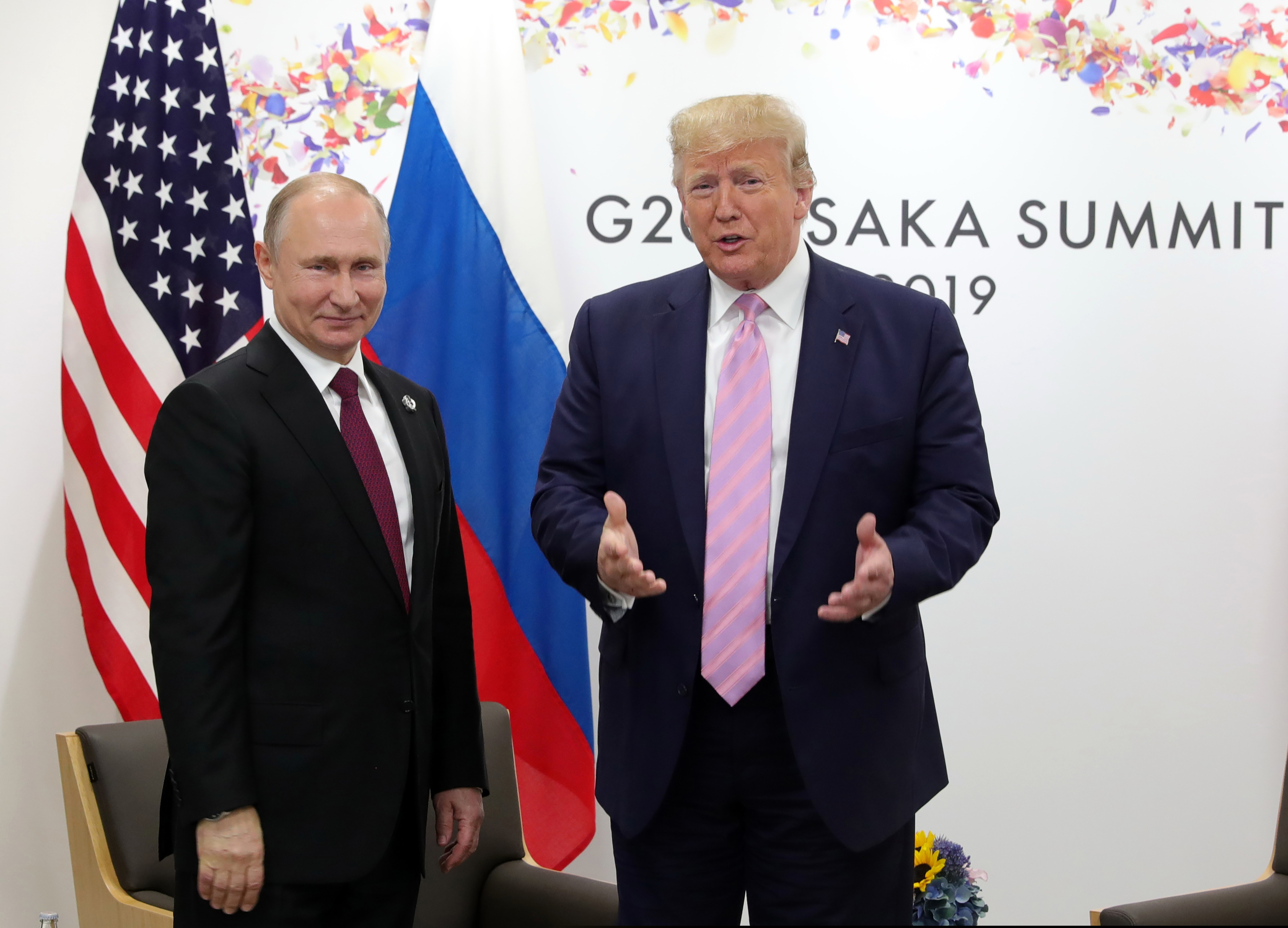 U.S. President Donald Trump, right, and Russian President Vladimir Putin pose for a photo during a bilateral meeting on the sidelines of the G-20 summit in Osaka, Japan, Friday, June 28, 2019. (Mikhail Klimentyev, Sputnik, Kremlin Pool Photo via AP)