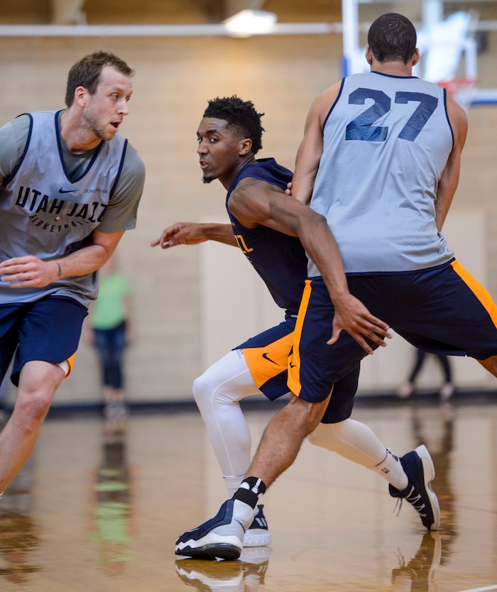 (Steve Griffin  |  The Salt Lake Tribune)    Utah Jazz guard  Donovan Mitchell  fights through Rudy Gobert's screen as the Jazz scrimmage in the Warrior Fitness Center on Hill Air Force Base as a part of a "Hoops for Troops" promotion Ogden Friday September 29, 2017. It's also Utah's first public scrimmage of the season, and the first look at how the new pieces of the team will work together. 
