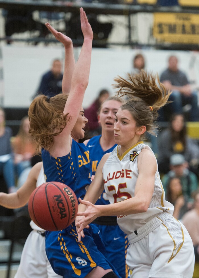 (Rick Egan  |  The Salt Lake Tribune)     Cicely Foley (25) Judge Memorial, collides with Delaney Palmer (34) in 3A Women's basketball playoff action Judge Memorial vs. San Juan, in Heber City, Friday, Feb. 16, 2018.