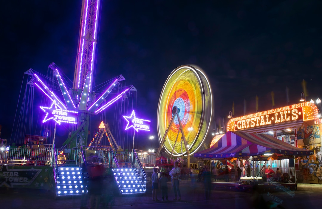 (Rick Egan  |  The Salt Lake Tribune)   The Star Tower an the Ferris Wheel light up the night, at the Utah State Fair, on a busy Monday,  Sept. 10, 2018.