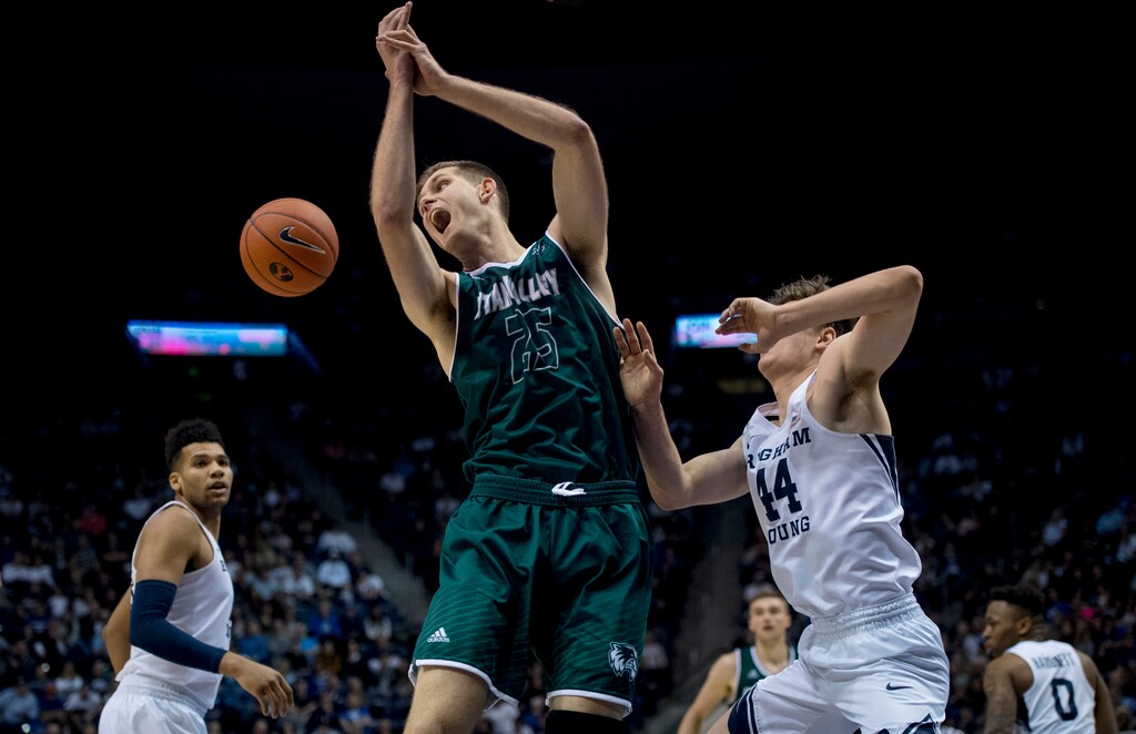 Utah Valley forward Wyatt Lowell (25) loses control of the ball while guarded by BYU guard Connor Harding (44) during an NCAA college basketball game Friday, Nov. 9, 2018, in Provo, Utah. (Isaac Hale/The Daily Herald via AP)