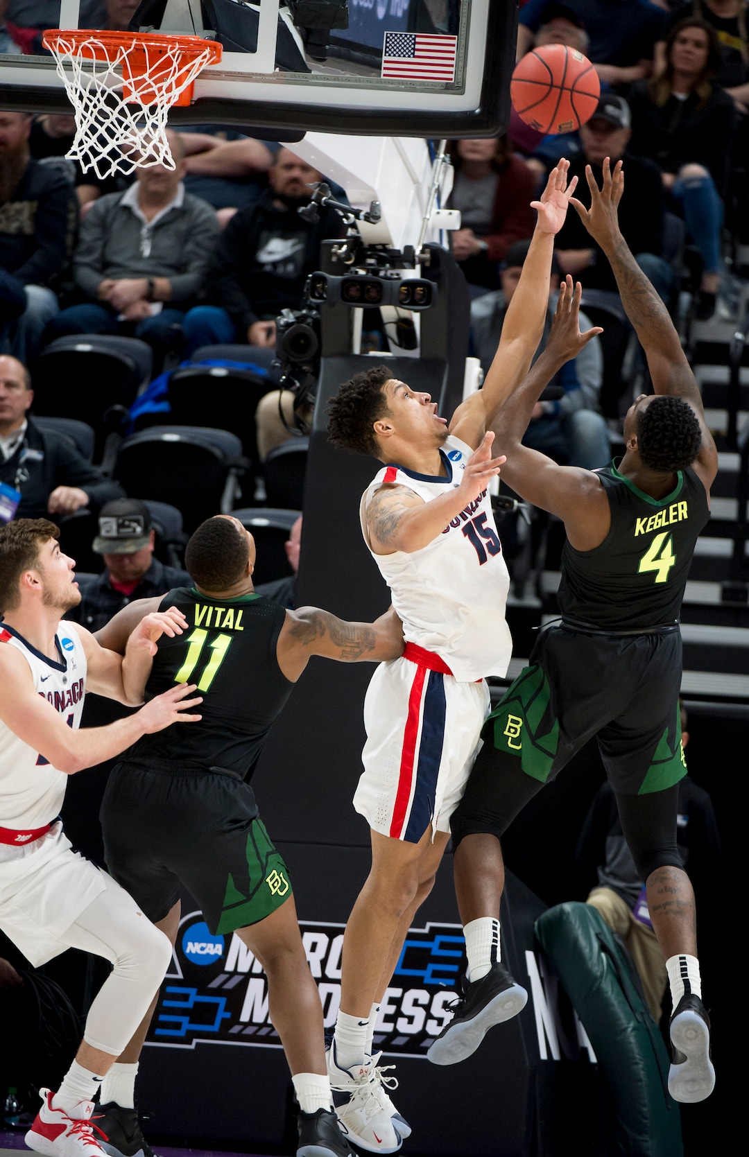 (Leah Hogsten  | The Salt Lake Tribune)  Baylor Bears guard Mario Kegler (4) shoots over Gonzaga Bulldogs forward Brandon Clarke (15) as Baylor faces Gonzaga in the second round of the NCAA tournament in Salt Lake City on Saturday, March 23, 2019.