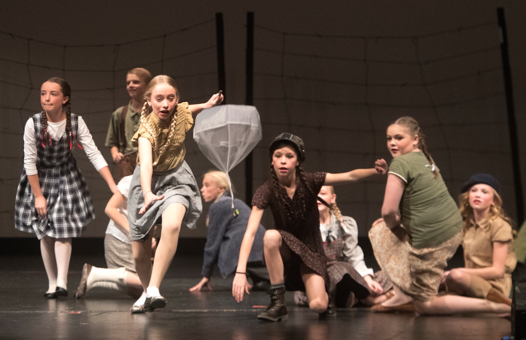 (Rick Egan  |  The Salt Lake Tribune) Mueller Park Jr High students playing children from West Berlin, chase handkerchiefs with candy bars attached in the Mueller Park Jr High production of "The Berlin Candy Bomber" at Woods Cross High School, Saturday, November 11, 2017.