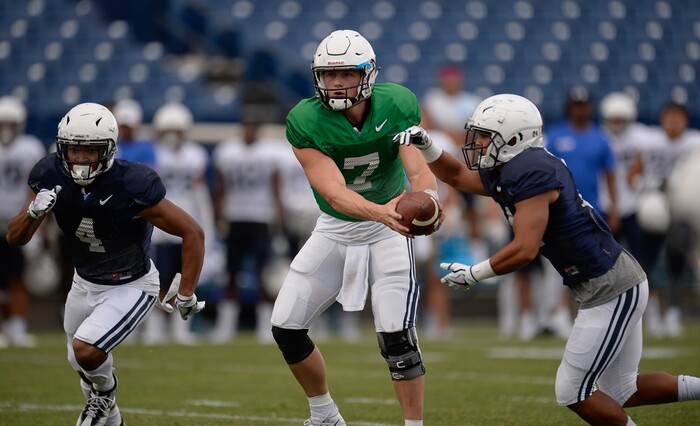 (Francisco Kjolseth  |  The Salt Lake Tribune)  Quarterback Beau Hoge makes his move as BYU holds a scrimmage at LaVell Edwards Stadium in Provo on Thursday, Aug. 10, 2017.