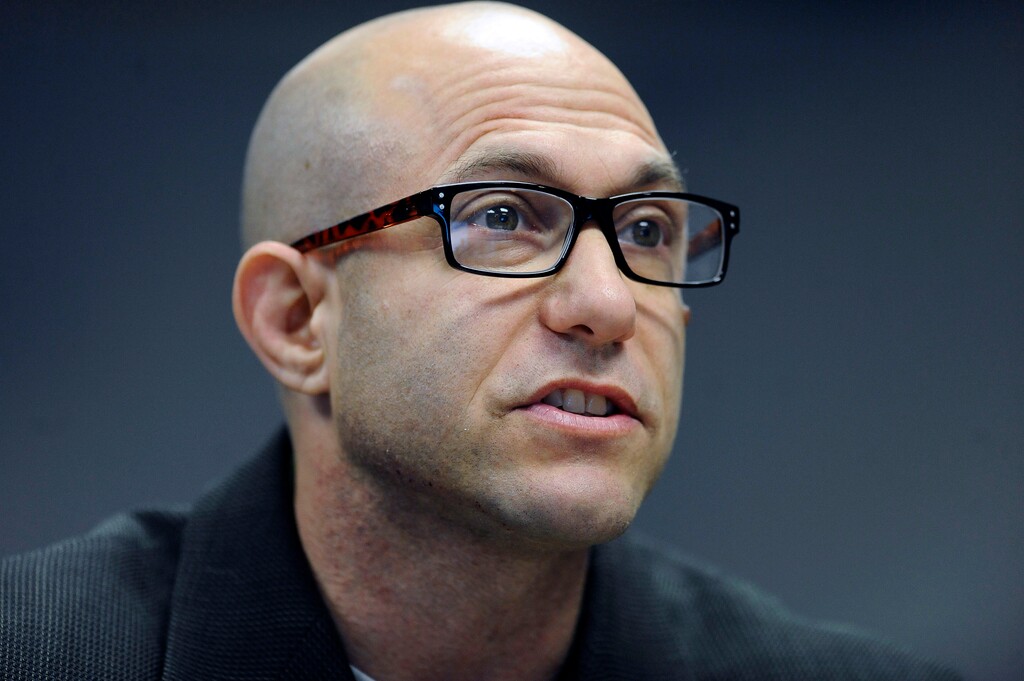 FILE - In this Nov. 14, 2014 file photo, Jeremy Richman, father of Sandy Hook Elementary school shooting victim Avielle Richman, addresses the Sandy Hook Advisory Commission in Newtown, Conn. Richman was found dead early Monday, March 25, 2019, at the town hall in Newtown, where he had an office. The chief medical examiner's office was to perform an autopsy Monday. Richman’s death comes as officials in Parkland, Florida, are publicizing counseling services after two survivors of a high school massacre there killed themselves.  (AP Photo/Jessica Hill, File)
